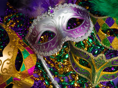 Mardi Gras masks with colorful beads and feathers