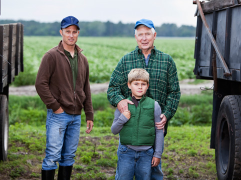 three generations of farmers in their field